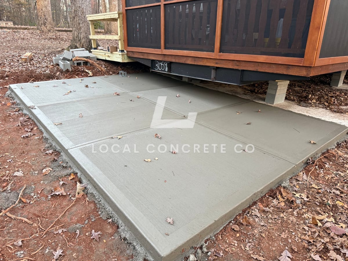Newly poured Concrete Patios in Charlotte, NC (Mecklenburg County) by Local Concrete Lake Norman — 4000 PSI mix, double-mat #4 rebar, broom-finish surface, 28-day full cure.