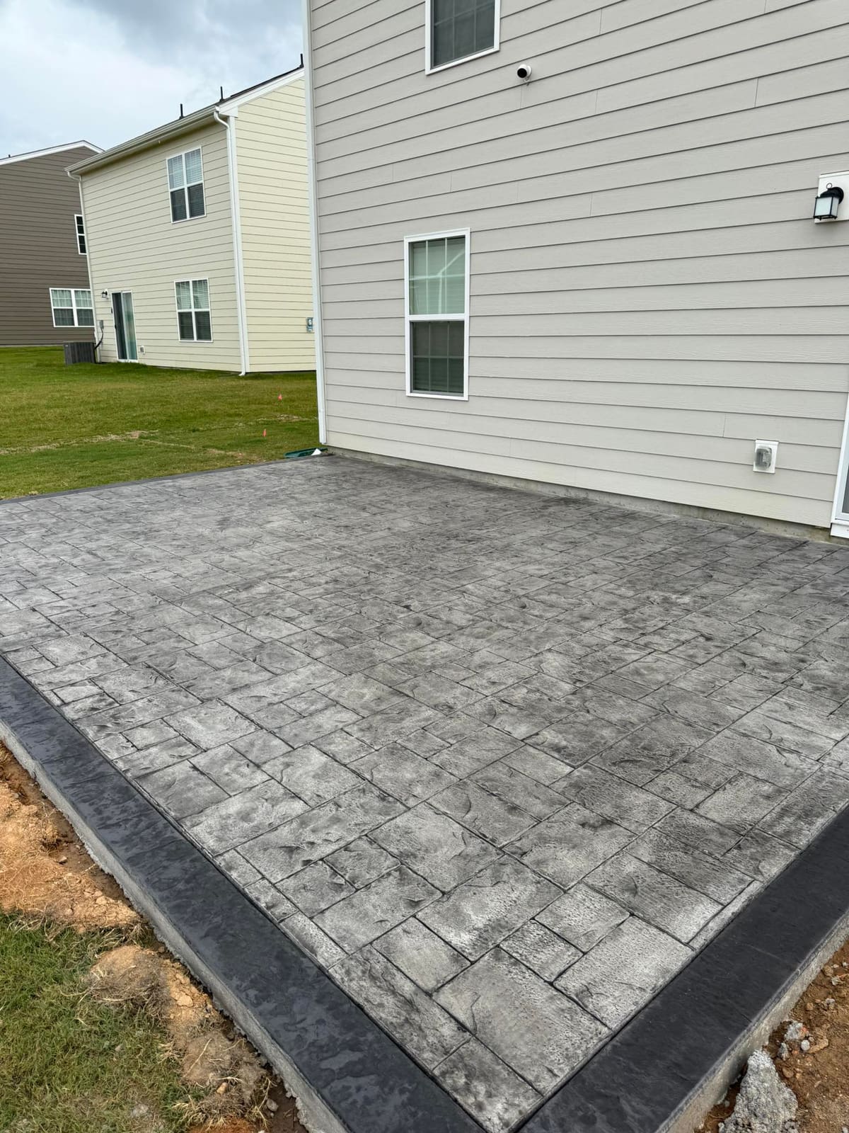 Professional Stamped Concrete installation in Charlotte, North Carolina by Local Concrete Lake Norman — commercial-grade base prep, 6-inch compacted aggregate, expansion joints sawn within 12 hours.